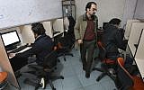 In this file photo from January 18, 2011, Iranians work in an internet cafe in central Tehran, Iran. (AP Photo/Vahid Salemi, File)