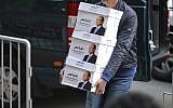 In this undated file image released Wednesday, Jan. 24, 2018 on the official Facebook account of Egyptian President Abdel-Fattah el-Sissi, shows workers carrying boxes that bear the president's image and the phrase "long live Egypt!" in Cairo, Egypt. (Egyptian President's Facebook page via AP, File)