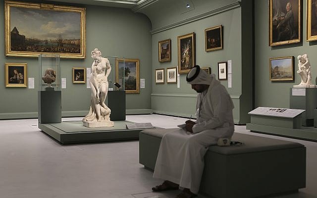 An Emirati man next to the Bather, also called Venus, statue by Christophe-Gabriel Allegrain, 1710-1795, at the Louvre Museum in Abu Dhabi, United Arab Emirates, December 19, 2017. (AP Photo/Kamran Jebreili) An Emirati man next to the Bather, also called Venus, statue by Christophe-Gabriel Allegrain, 1710-1795, at the Louvre Museum in Abu Dhabi, United Arab Emirates, December 19, 2017. (AP Photo/Kamran Jebreili)