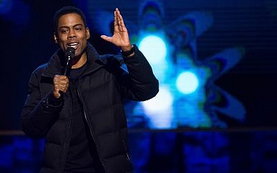 Comedian Chris Rock performs at Comedy Central's 'Night of Too Many Stars: America Comes Together for Autism Programs' in New York, February 28, 2015. (Charles Sykes/Invision/AP)