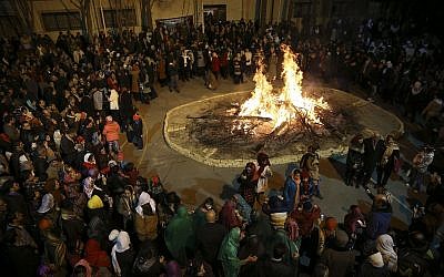 Iranian Zoroastrians gather around a giant bonfire in a ceremony celebrating their ancient mid-winter Sadeh festival in Tehran, Iran, Friday, January 30, 2015. (AP/Vahid Salemi)