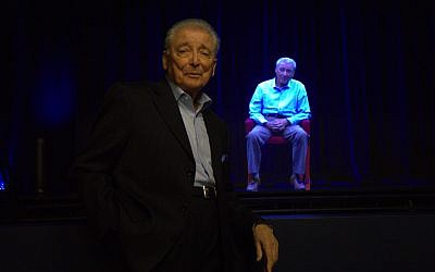 Aaron Elster stands in front of his hologram. (Ron Gould/via JTA)