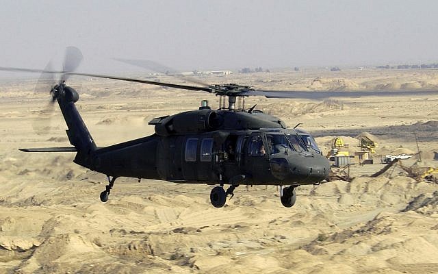 Illustrative: A Blackhawk helicopter belonging to the US military flies over Iraq in 2004. (SSgt Suzanne M. Jenkins, United States Air Force, Wikipedia)