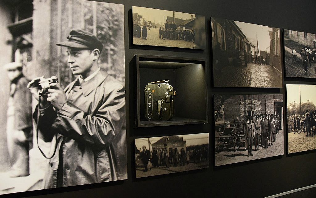 View of section of 'Flashes of Memory' exhibition at Yad Vashem showing image of photographer Zvi Hirsch Kadushin (later George Kaddosh) in the Kovno ghetto, his camera, and some of the photos he smuggled out after going into hiding before the ghetto's liquidation. (Courtesy of Yad Vashem)