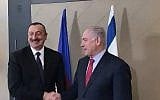 Prime Minister Benjamin Netanyahu (R) shakes hands with Azerbaijan President Ilham Aliyev at the World Economic Forum in Davos, Switzerland on January 24, 2018. (Jacob Magid/Times of Israel)