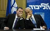 Prime Minister Benjamin Netanyahu speaks with then-Knesset Speaker Yuli Edelstein during a Likud faction meeting at the Knesset in Jerusalem on October 27, 2014. (Yonatan Sindel/Flash90)