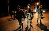 Illustrative. Israeli soldiers seen during a raid on the al-Huriya radio station on suspicion of incitement to violence in the West Bank city of Hebron on August 31, 2017. (Wisam Hashlamoun/Flash90)