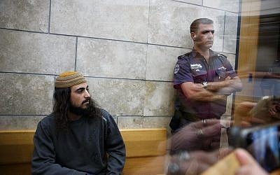 Yinon Reuveni (L) attends his sentencing for at the Nazareth Magistrate's Court on December 12, 2017. (Basel Awidat/Flash90)