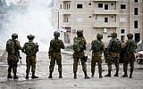 IDF soldiers clash with Palestinians in Al-Fawwar refugee camp, south of the West Bank city of Hebron, on December 31, 2017. (Wisam Hashlamoun/Flash90)
