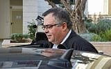 Likud MK David Bitan leaves his home en route to an interrogation at the Lahav 433 anti-corruption unit's headquarters in Lod, January 4, 2018 (Flash90)