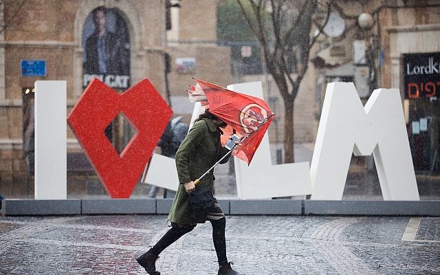 People hold umbrellas to protect themselves from the rain as they walk in Jaffa street in Jerusalem, as heavy rain and wind storm hits Israel. January 05, 2018. (Yonatan Sindel/Flash90) People hold umbrellas to protect themselves from the rain as they walk in Jaffa street in Jerusalem, as heavy rain and wind storm hits Israel. January 05, 2018. (Yonatan Sindel/Flash90)