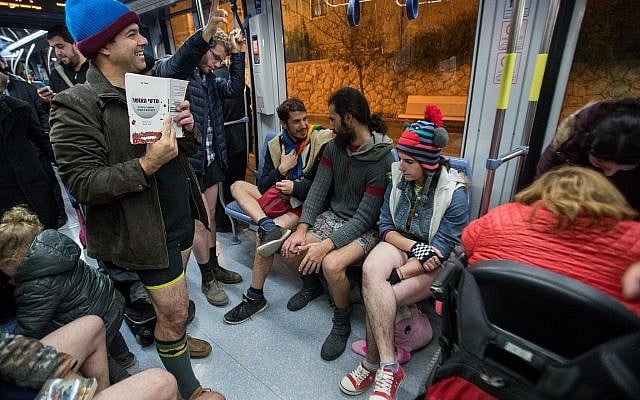 People participate in the event of "No Pants Subway Ride" an annual tradition that started in New York in 2002, and is now a global event in the Jerusalem Light Rail on January 7, 2018. (Yonatan Sindel/Flash90) People participate in the event of "No Pants Subway Ride" an annual tradition that started in New York in 2002, and is now a global event in the Jerusalem Light Rail on January 7, 2018. (Yonatan Sindel/Flash90)