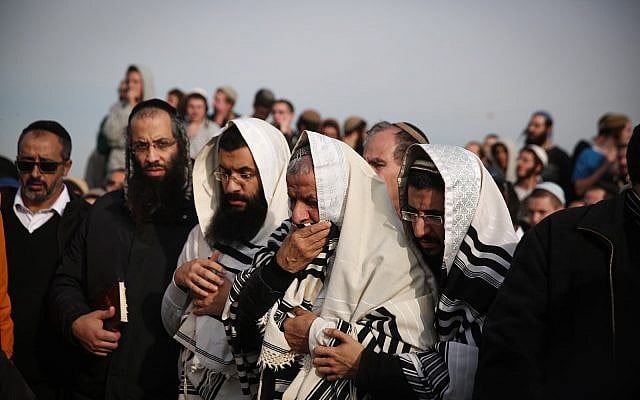 Friends and family attend the funeral of Rabbi Raziel Shevach, 35, in the West Bank outpost of Havat Gilad on January 10, 2018. (Miriam Alster/Flash90) Friends and family attend the funeral of Rabbi Raziel Shevach, 35, in the West Bank outpost of Havat Gilad on January 10, 2018. (Miriam Alster/Flash90)
