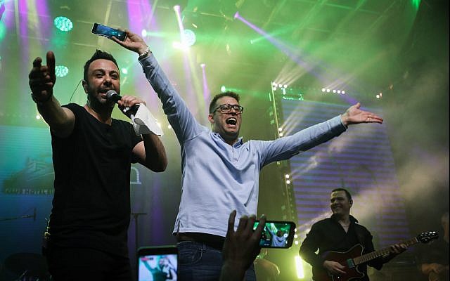 MK Oren Hazan (C) dances on stage during a concert at the 'Likudiada,' a gathering of Likud party members and supporters in the southern city of Eilat, on January 12, 2018. (Noam Revkin Fenton/Flash90) MK Oren Hazan (C) dances on stage during a concert at the 'Likudiada,' a gathering of Likud party members and supporters in the southern city of Eilat, on January 12, 2018. (Noam Revkin Fenton/Flash90)