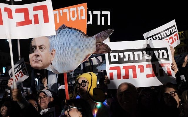 Demonstrators attend the weekly anti-corruption protest in Tel Aviv on January 13, 2018. (Tomer Neuberg/Flash90) Demonstrators attend the weekly anti-corruption protest in Tel Aviv on January 13, 2018. (Tomer Neuberg/Flash90)