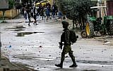 Illustrative: Palestinians clash with IDF soldiers in the West Bank city of Jenin, January 18, 2018. (Nasser Ishtayeh/Flash90)