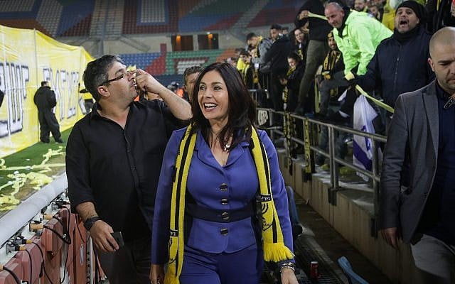 Culture and Sports Minister Miri Regev seen with fans before the start of a match between Beitar Jerusalem and Bnei Sakhnin F.C., at the Teddy Stadium in Jerusalem on January 22, 2018. (Roy Alima/Flash90) Culture and Sports Minister Miri Regev seen with fans before the start of a match between Beitar Jerusalem and Bnei Sakhnin F.C., at the Teddy Stadium in Jerusalem on January 22, 2018. (Roy Alima/Flash90)