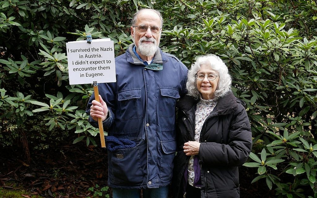 George and Judy Tanner pose with the sign they held at a February rally after a surge in neo-Nazi and anti-Semitic graffiti appeared in Eugene, Oregon. (Judy Tanner) George and Judy Tanner pose with the sign they held at a February rally after a surge in neo-Nazi and anti-Semitic graffiti appeared in Eugene, Oregon. (Judy Tanner)