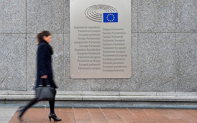 A woman walks past a placard with the words European Parliament inscribed in several languages of the European Union member states outside the Espace Leopold on February 25, 2016 in Brussels, Belgium. (Ben Pruchnie/Getty Images via JTA) A woman walks past a placard with the words European Parliament inscribed in several languages of the European Union member states outside the Espace Leopold on February 25, 2016 in Brussels, Belgium. (Ben Pruchnie/Getty Images via JTA)