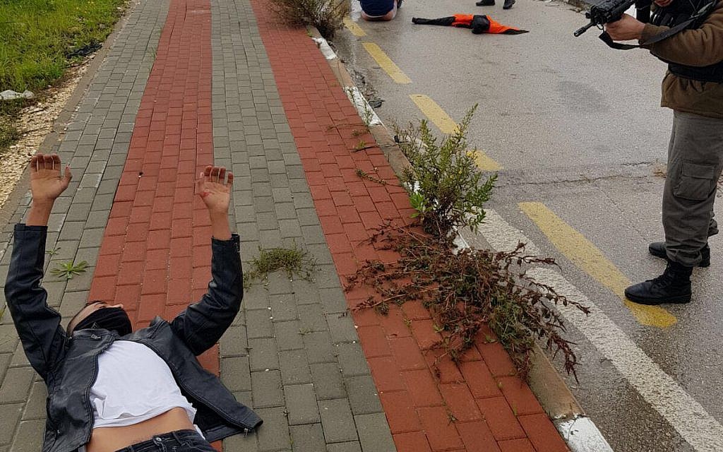 Two injured Palestinians, on the ground, after being shot during an attempted stabbing attack at the Tapuah Junction in the West Bank, January 23, 2018. (Samaria Regional Council)