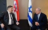 Prime Minister Benjamin Netanyahu (R) meets with Croatian Prime Minister Andrej Plenkovic at the World Economic Forum in Davos, Switzerland on January 24, 2018. (Amos Ben-Gershom/GPO)