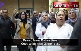 Activists in Tunisia demonstrate against a Holocaust exhibition held at the National Library there, on December 15, 2017. (Screen capture: MEMRI)