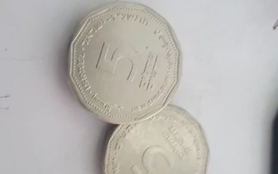 This photo published on Sunday, January 21, 2018 shows fake five-shekel coins produced by a 40-year-old engraver in Arad in southern Israel. ( Israel Police)