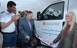 Illustrative: (From left) Magen David Adom Director Avi Bin, Sheldon and Miriam Adelson unveil one of five new bullet proof ambulances that the Adelsons donated to four West Bank settlements. (Courtesy: Magen David Adom)
