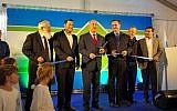 Prime Minister Benjamin Netanyahu (c) cuts the ribbon at the inauguration ceremony of a new bypass road in the northern West Bank on January 30, 2018. (Samaria Regional Council)