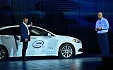 Prof. Amnon Shashua, left, senior VP at Intel and CEO of Mobileye, arrived on stage at CES in the backseat of an autonomous car during the preshow keynote of Intel's CEO Brian Krzanich, right, in January 2018. (Walden Kirsch/Intel Corp)
