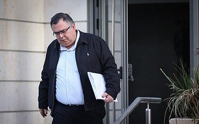 Likud Knesset member and former coalition chairman David Bitan leaves his home on his way to another round of questioning at the Lahav 433 unit of the Israel Police, January 4, 2018. (Flash90)
