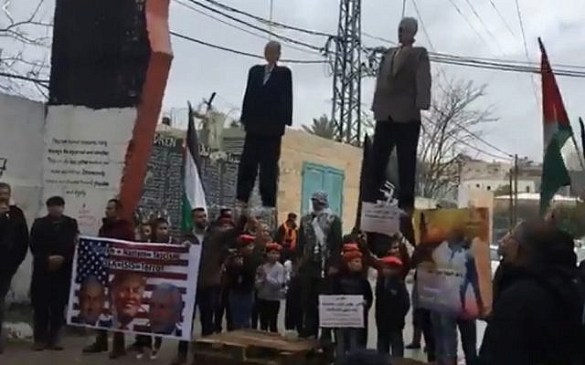 Palestinians in the Aida refugee camp near Bethlehem hang effigies of Donald Trump and Mike Pence, January 27, 2018 (Facebook)