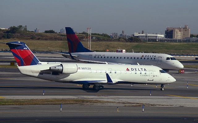Two Delta Connection passenger jets at LaGuardia Airport in New York, October 2017. (Robert Alexander/Getty Images via JTA) Two Delta Connection passenger jets at LaGuardia Airport in New York, October 2017. (Robert Alexander/Getty Images via JTA)
