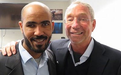 Yikealo Beyene, left, an Eritrean refugee, with Joey Low, an American Jewish philanthropist, in Washington, DC, Jan. 8, 2018. (Ron Kampeas via JTA)