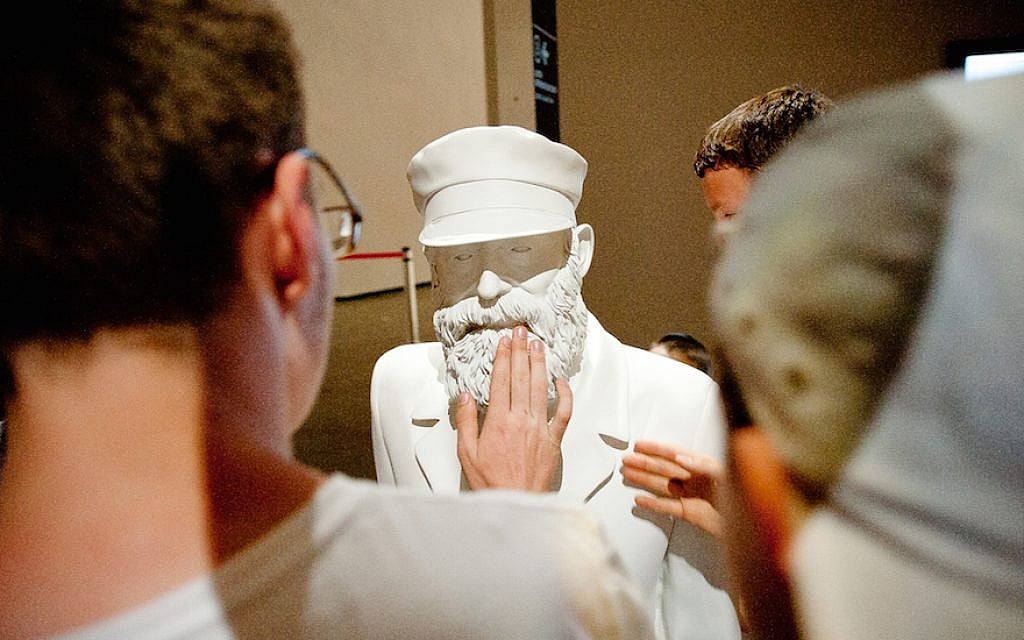 Visitors to the Jewish Museum and Tolerance Center in Moscow viewing one of the many sculptures there depicting the history of Jewish life in Russia, May 21, 2013. (Courtesy of the Jewish Museum and Tolerance Center/via JTA) Visitors to the Jewish Museum and Tolerance Center in Moscow viewing one of the many sculptures there depicting the history of Jewish life in Russia, May 21, 2013. (Courtesy of the Jewish Museum and Tolerance Center/via JTA)