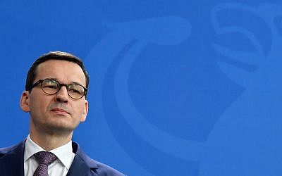 Polish Prime Minister Mateusz Morawiecki gives a press conference with the German Chancellor on February 16, 2018 at the Chancellery in Berlin. (AFP Photo/John MacDougall)