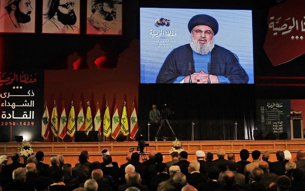Hezbollah leader Hassan Nasrallah delivers a televised speech during a ceremony held by the terror group in Beirut commemorating its killed leaders on February 16, 2018. (AFP Photo/Joseph Eid)