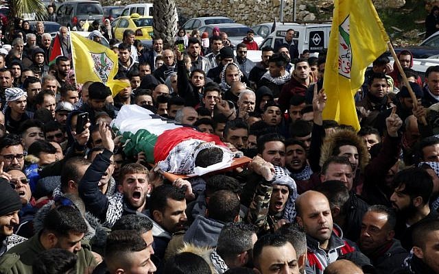 Relatives mourn over the body of Hamzeh Yousef Zamaareh, during his funeral in the West Bank city of Halhul, on February 17, 2018. (AFP Photo/Hazem Bader) Relatives mourn over the body of Hamzeh Yousef Zamaareh, during his funeral in the West Bank city of Halhul, on February 17, 2018. (AFP Photo/Hazem Bader)