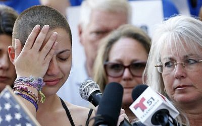 Marjory Stoneman Douglas High School student Emma Gonzalez (L) reacts during her speech at a gun control rally at the Broward County Federal Courthouse in Fort Lauderdale, Florida, on February 17, 2018. (AFP Photo/Rhona Wise)