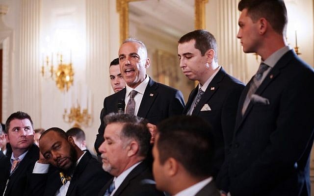 Andrew Pollack (C), flanked by his sons, speaks during 'listening session' on gun violence with US President Donald Trump, teachers and students in the State Dining Room of the White House on February 21, 2018. (AFP Photo/Mandel Ngan) Andrew Pollack (C), flanked by his sons, speaks during 'listening session' on gun violence with US President Donald Trump, teachers and students in the State Dining Room of the White House on February 21, 2018. (AFP Photo/Mandel Ngan)