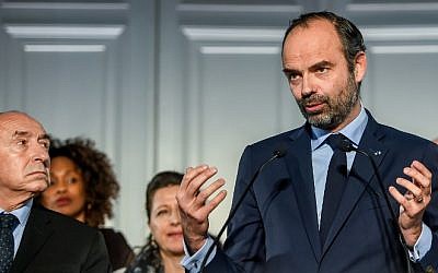 French Prime Minister Edouard Philippe, flanked by members of the government, delivers a speech during the presentation of the national plan for the prevention of radicalization, in Lille, northern France, on February 23, 2018. (AFP/Philippe Huguen)