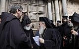 Greek Orthodox Patriarch of Jerusalem Theophilos III delivers a statement to the press announcing the closure of the Holy Sepulchre church as he stands next to the Custodian of the Holy Land Fr. Francesco Patton and Armenian Bishop Siwan, left, on February 25, 2018. (AFP/ GALI TIBBON)