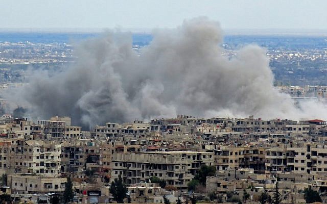 A general view taken from a government-held area in Damascus shows smoke rising from the rebel-held enclave of Eastern Ghouta on the outskirts of the Syrian capital following fresh air strikes and rocket fire on February 27, 2018. (AFP PHOTO / STRINGER) A general view taken from a government-held area in Damascus shows smoke rising from the rebel-held enclave of Eastern Ghouta on the outskirts of the Syrian capital following fresh air strikes and rocket fire on February 27, 2018. (AFP PHOTO / STRINGER)