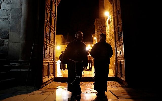 Franciscan friars enter the Church of the Holy Sepulchre in Jerusalem after it reopened on February 28, 2018, following a three-day closure to protest against Israeli tax measures and a proposed law. (AFP/ THOMAS COEX) Franciscan friars enter the Church of the Holy Sepulchre in Jerusalem after it reopened on February 28, 2018, following a three-day closure to protest against Israeli tax measures and a proposed law. (AFP/ THOMAS COEX)