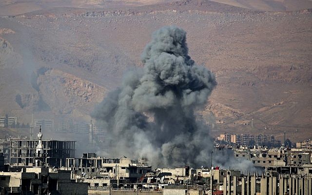 Smoke billows from an area that was targeted by Syrian government forces airstrikes in the rebel-held town of Arbin, on the outskirts of the Syrian capital Damascus, on February 1, 2018. (AFP PHOTO / ABDULMONAM EASSA) Smoke billows from an area that was targeted by Syrian government forces airstrikes in the rebel-held town of Arbin, on the outskirts of the Syrian capital Damascus, on February 1, 2018. (AFP PHOTO / ABDULMONAM EASSA)