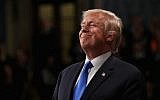 In this file photo taken on January 30, 2018 US President Donald Trump smiles during the State of the Union address in the chamber of the US House of Representatives on  in Washington, DC.  (AFP / POOL / Win McNamee)