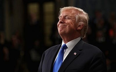 In this file photo taken on January 30, 2018 US President Donald Trump smiles during the State of the Union address in the chamber of the US House of Representatives on  in Washington, DC.  (AFP / POOL / Win McNamee)