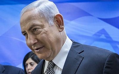 Prime Minister Benjamin Netanyahu on his way to the weekly cabinet meeting at his Jerusalem office on February 4, 2018. (AFP photo / Pool / Jim Hollander)