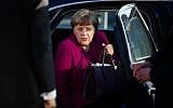German Chancellor Angela Merkel, leader of the conservative Christian Democratic Union (CDU), gets out of her car as she arrives for further talks to form a new government in Berlin, February 6, 2018. (DPA/Gregor Fischer/AFP)