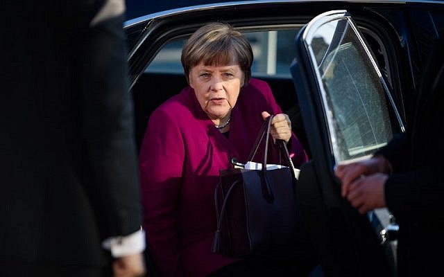 German Chancellor Angela Merkel, leader of the conservative Christian Democratic Union (CDU), gets out of her car as she arrives for further talks to form a new government in Berlin, February 6, 2018. (DPA/Gregor Fischer/AFP) German Chancellor Angela Merkel, leader of the conservative Christian Democratic Union (CDU), gets out of her car as she arrives for further talks to form a new government in Berlin, February 6, 2018. (DPA/Gregor Fischer/AFP)